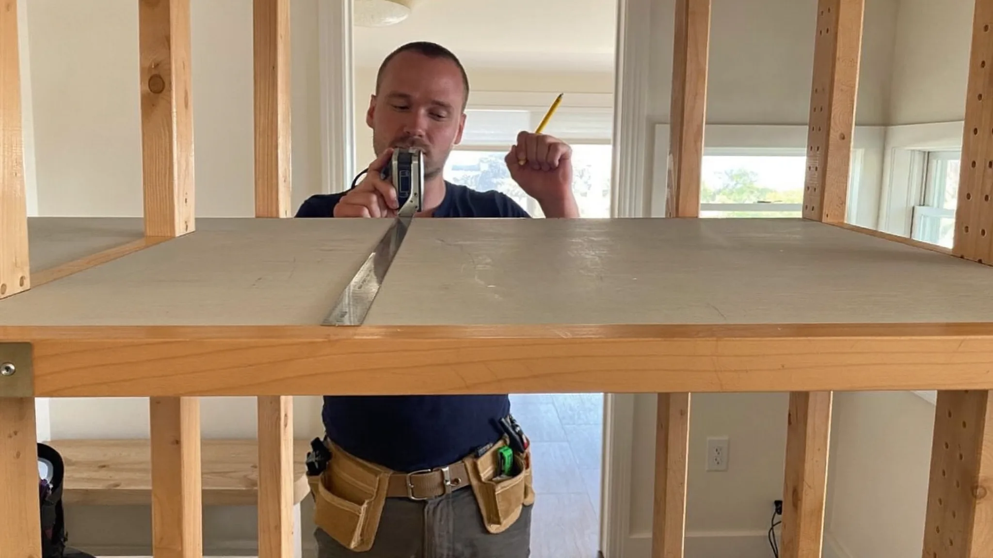 Handyman repairing a door in a client's home