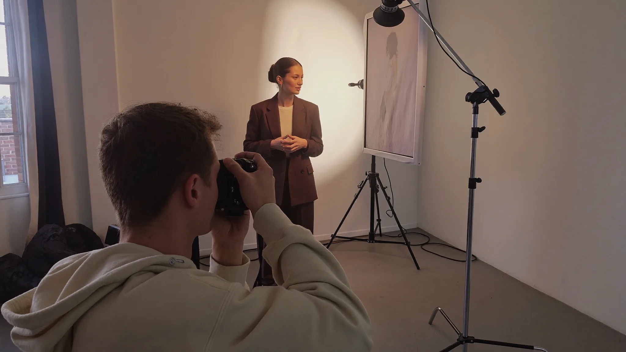 Photographer working with a client at an on-location shoot